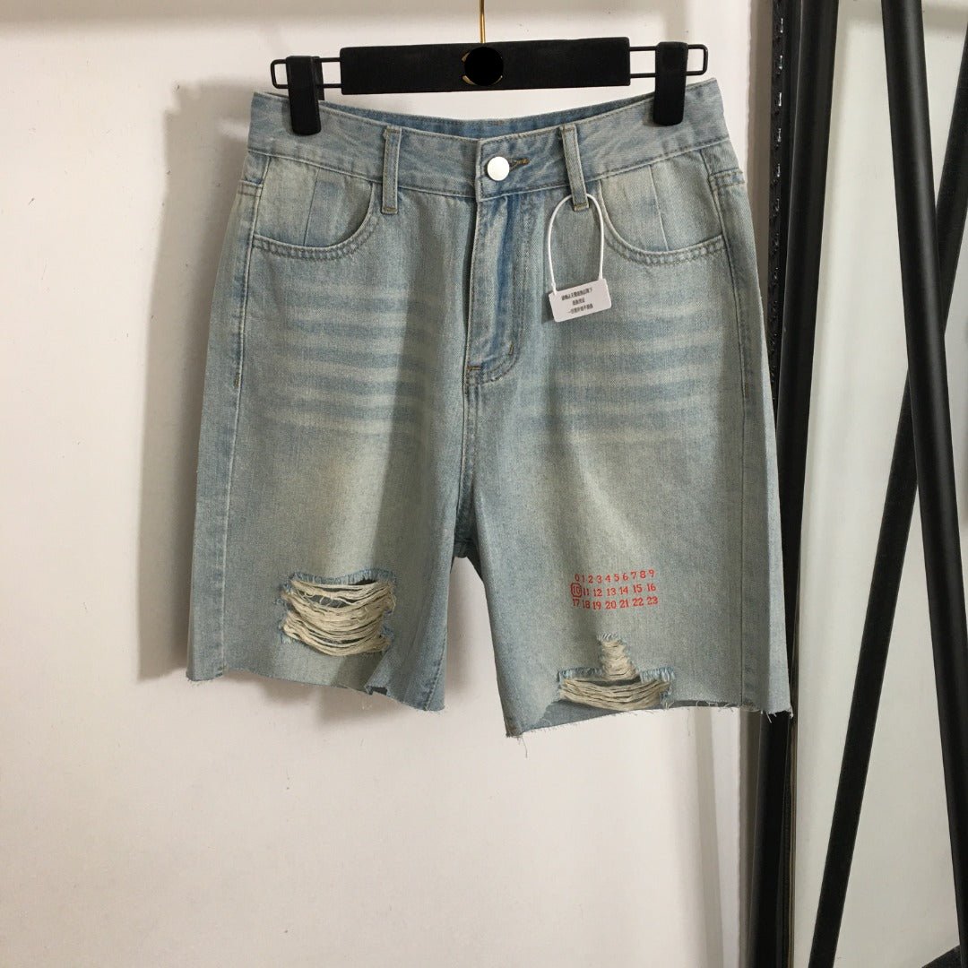 MM6 ripped denim shorts