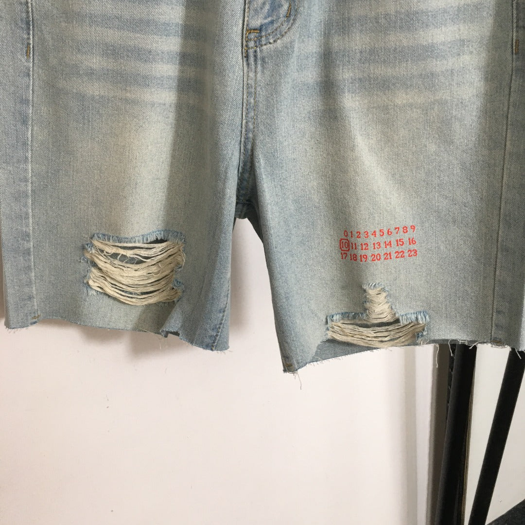MM6 ripped denim shorts