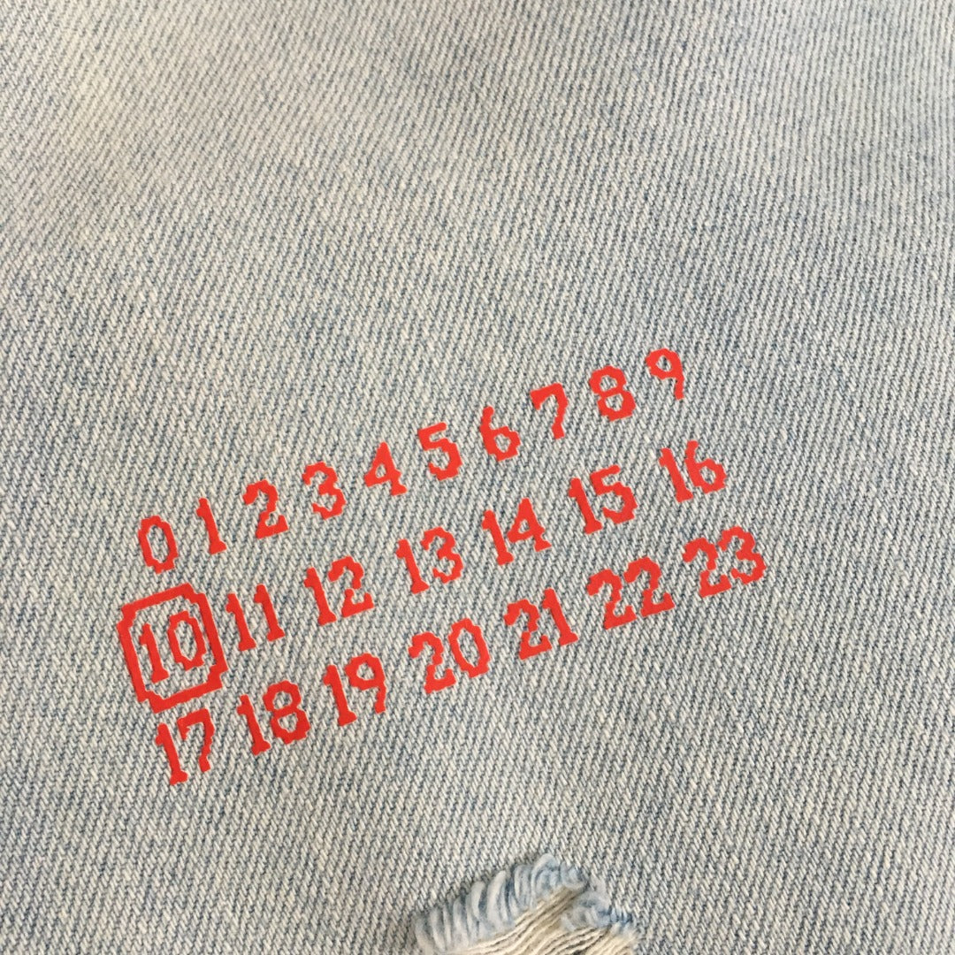 MM6 ripped denim shorts