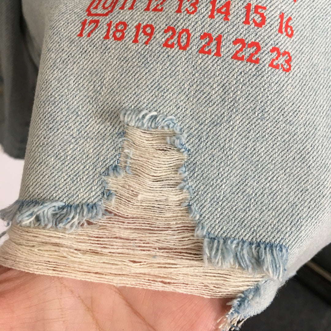 MM6 ripped denim shorts