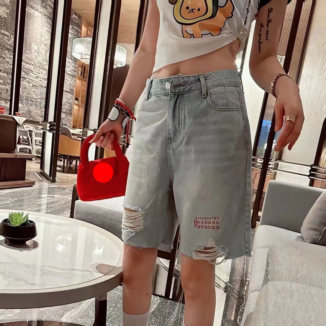 MM6 ripped denim shorts