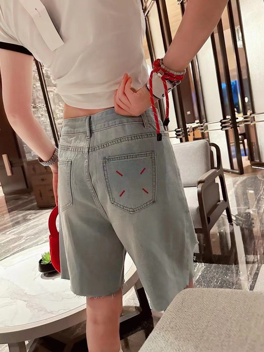 MM6 ripped denim shorts