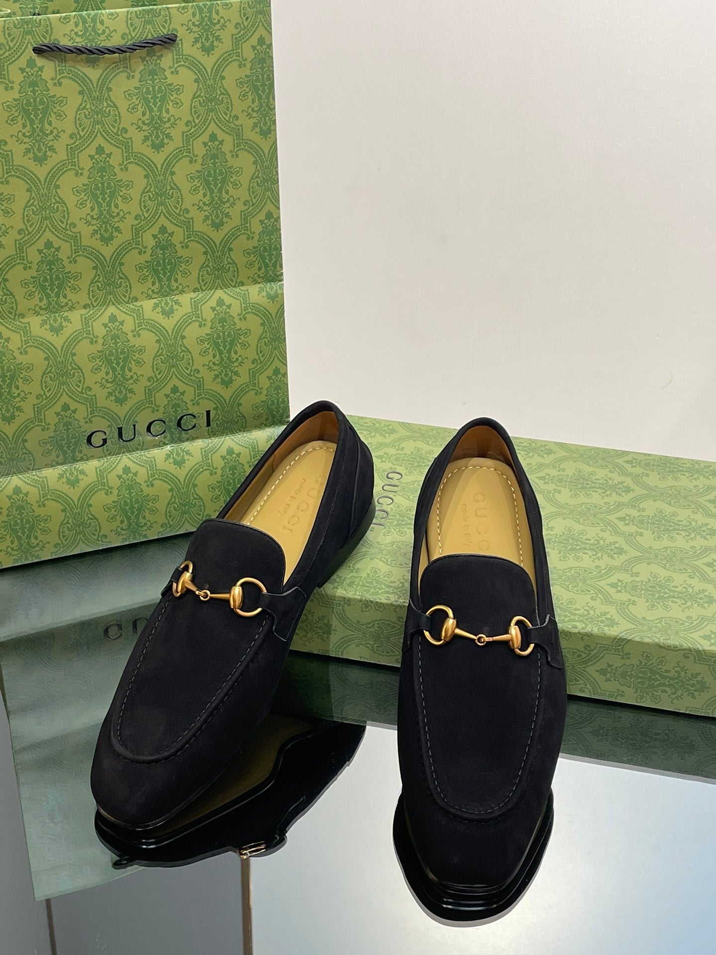 GG distressed black horsebit shoes