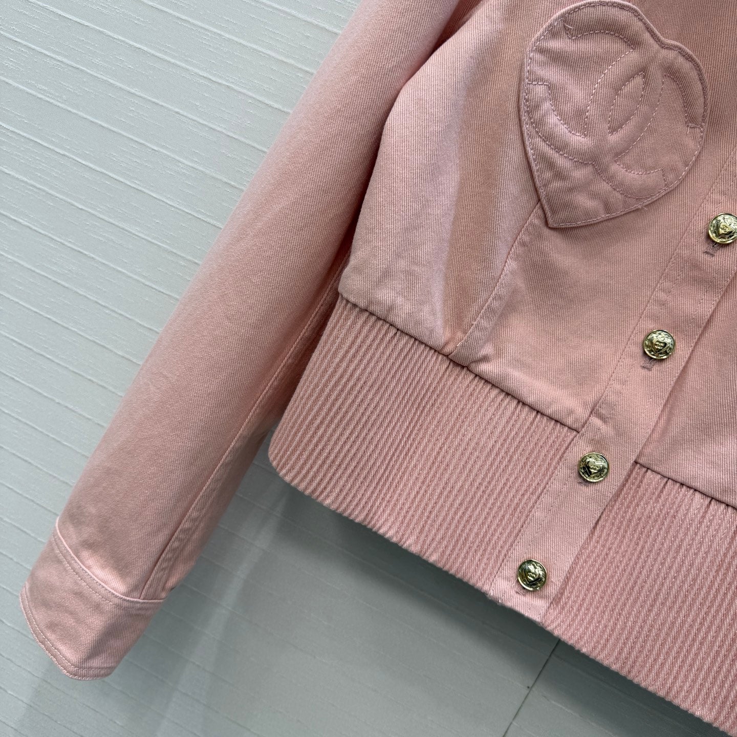 Chanel heart-patterned denim jacket / high-waisted jeans