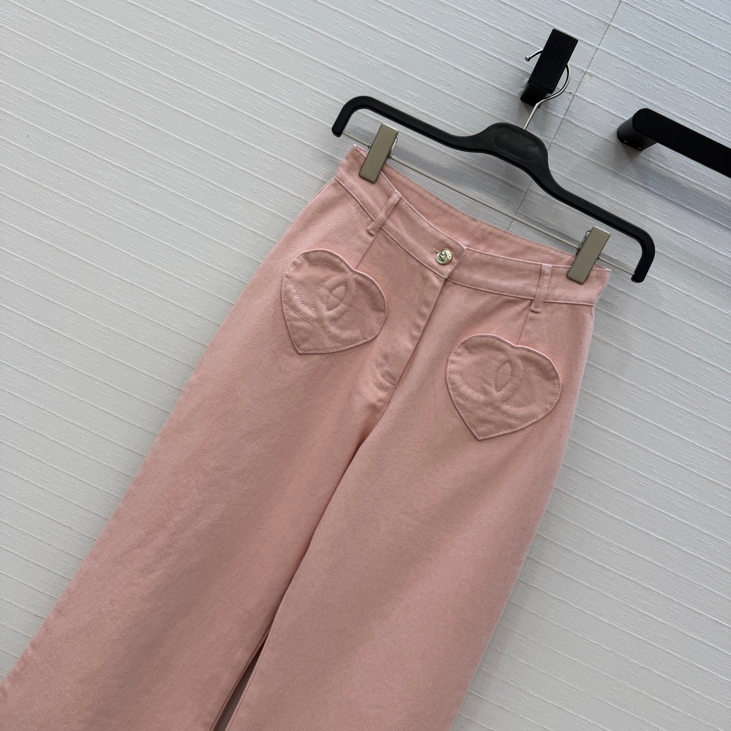 Chanel heart-patterned denim jacket / high-waisted jeans