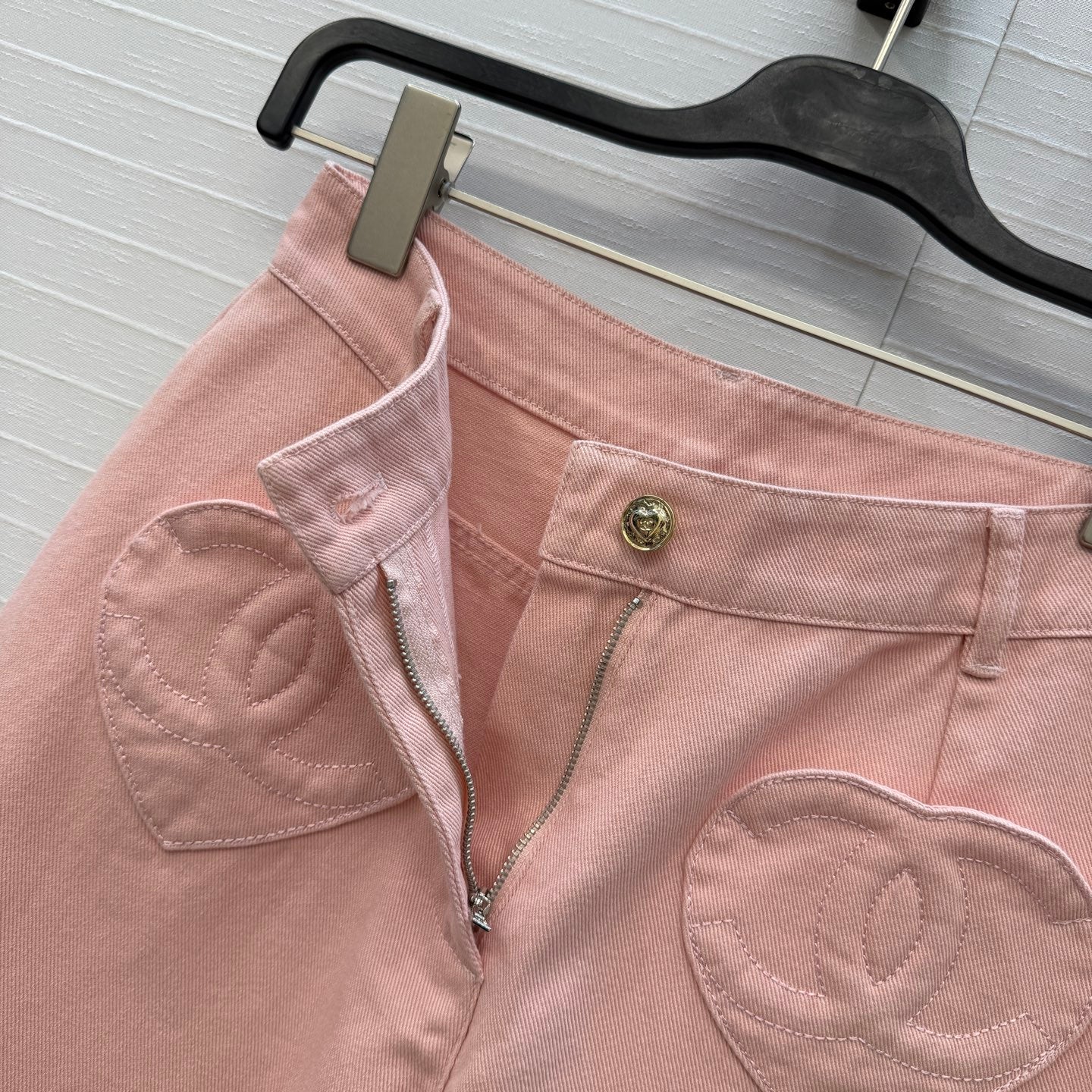 Chanel heart-patterned denim jacket / high-waisted jeans