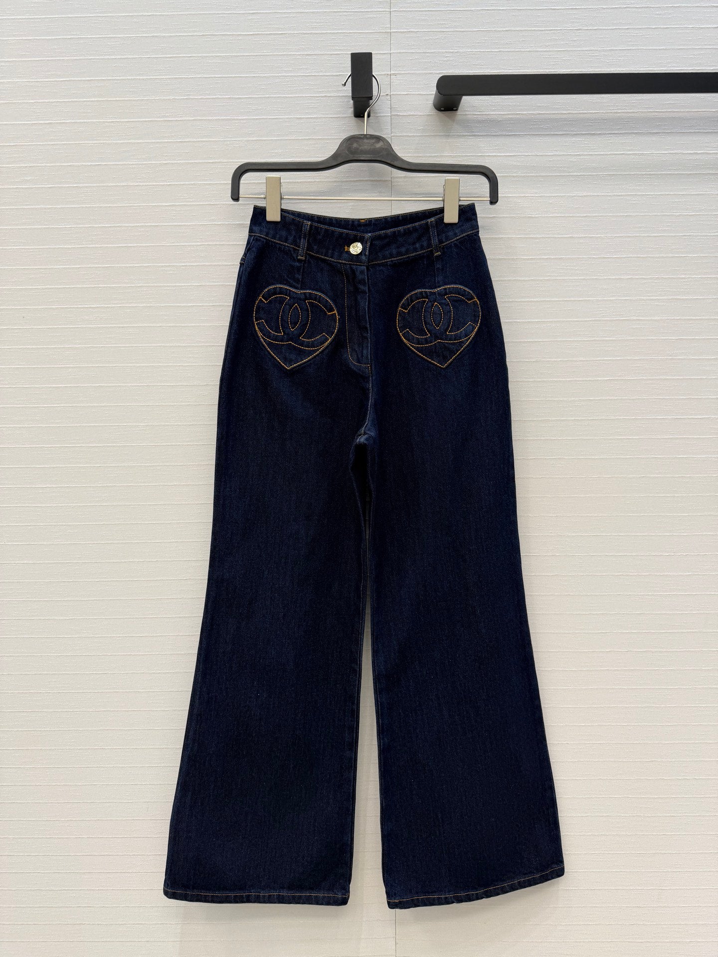 Chanel heart-patterned denim jacket / high-waisted jeans