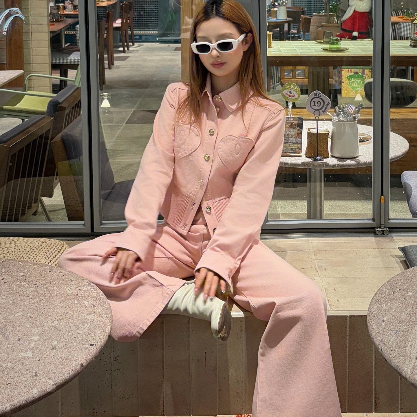 Chanel heart-patterned denim jacket / high-waisted jeans