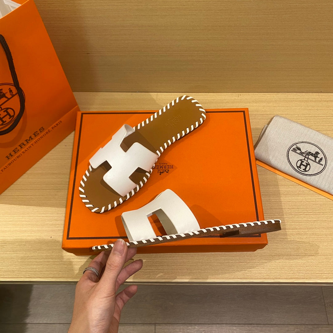 New H new woven slippers