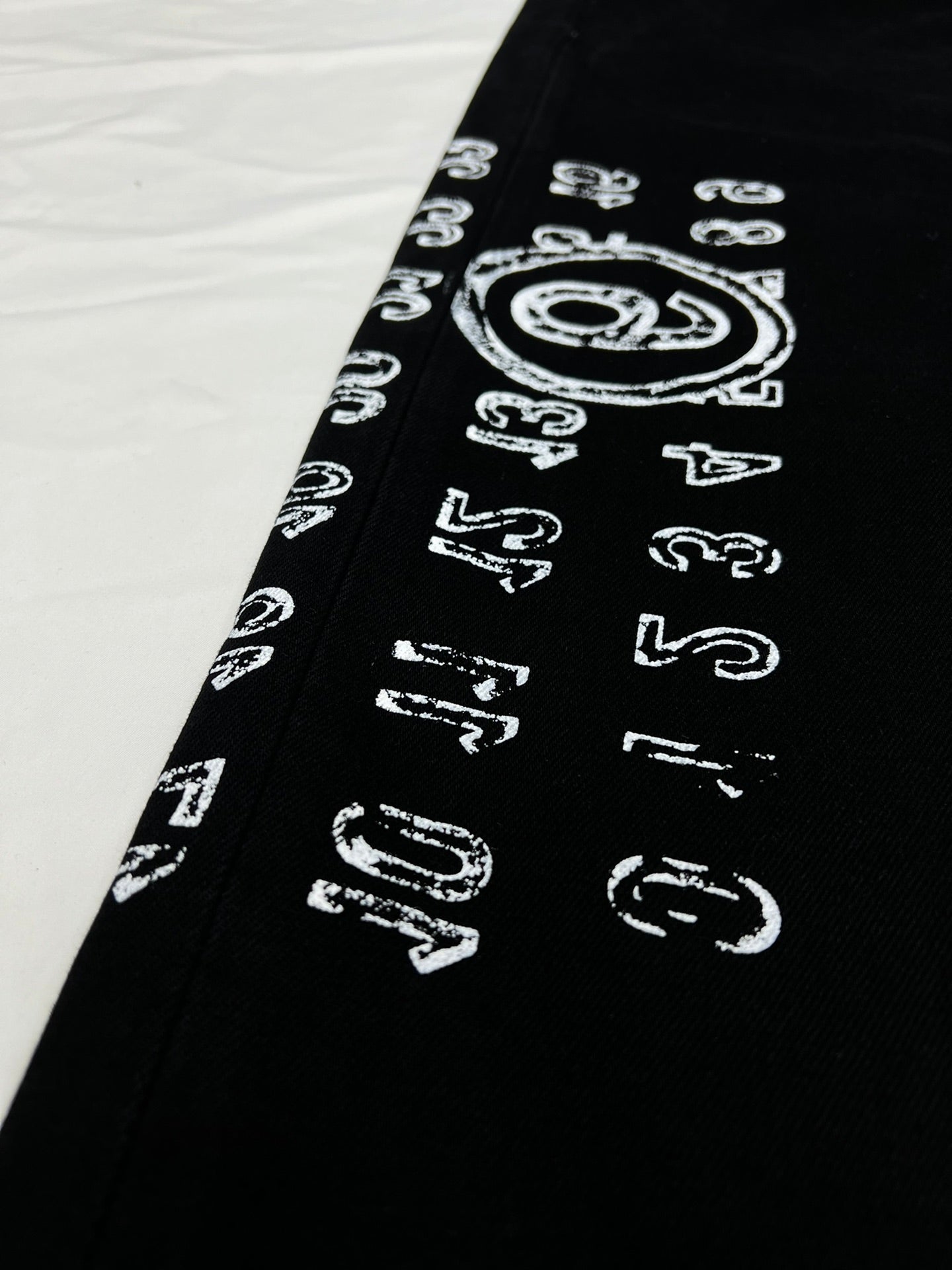 MM6 side printed letter patchwork trousers