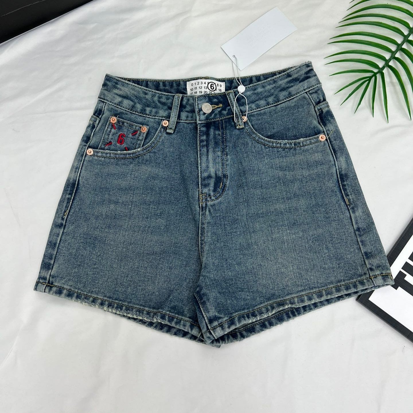 Margiela back pocket red embroidered number shorts