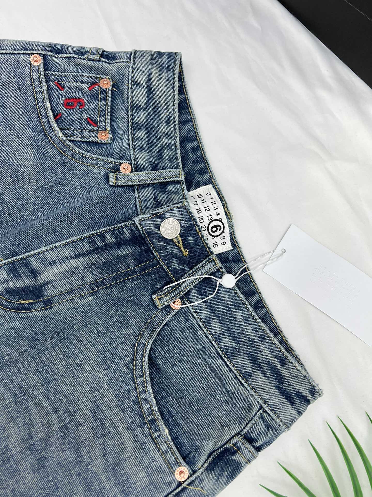 Margiela back pocket red embroidered number shorts