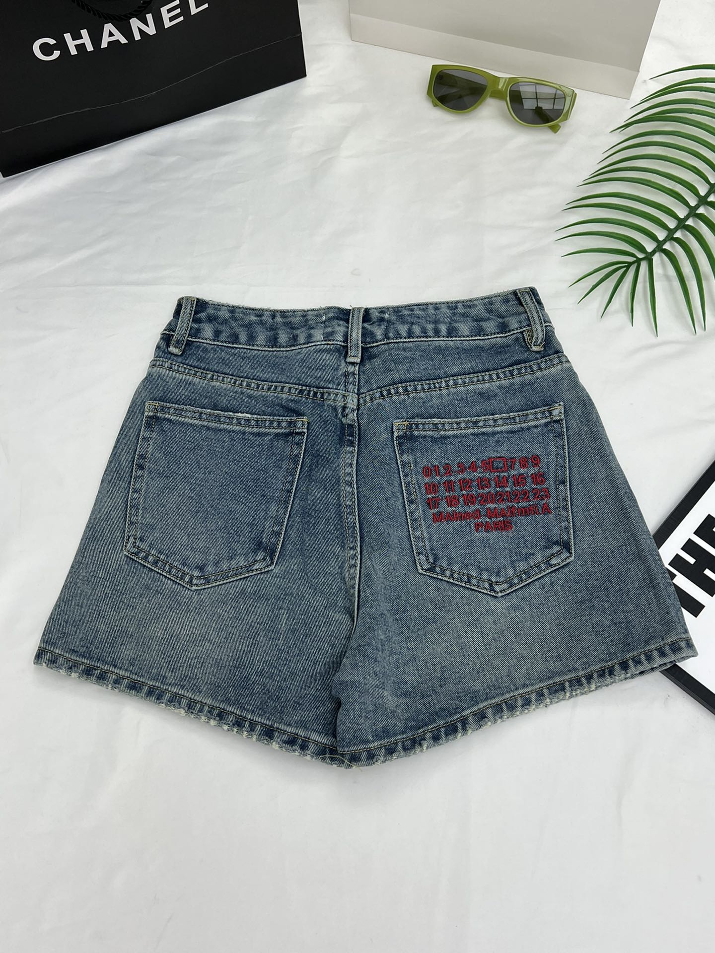 Margiela back pocket red embroidered number shorts