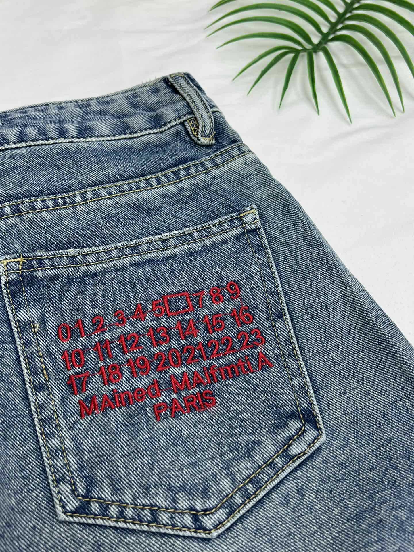 Margiela back pocket red embroidered number shorts