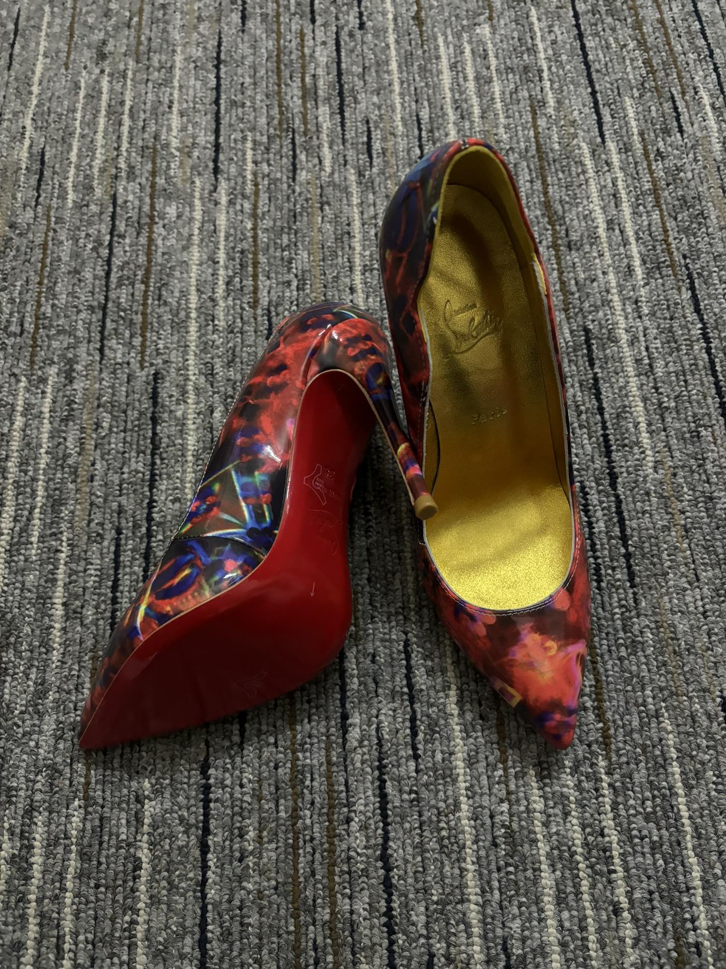 Christia** Loubout** floral high heels