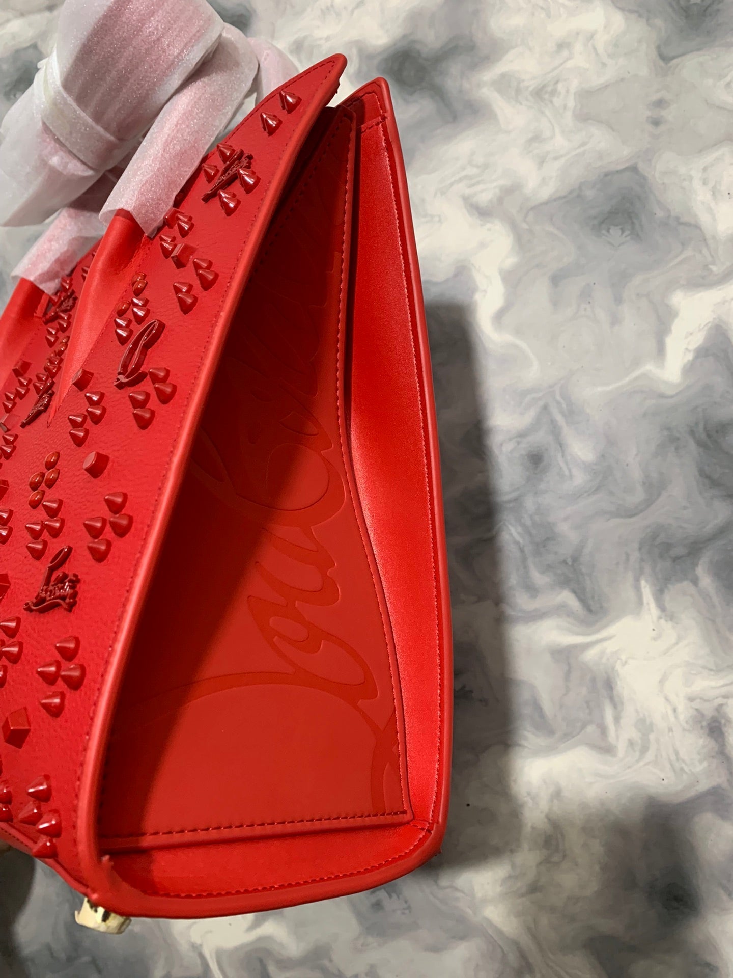 Christi** Loubout** red handbag