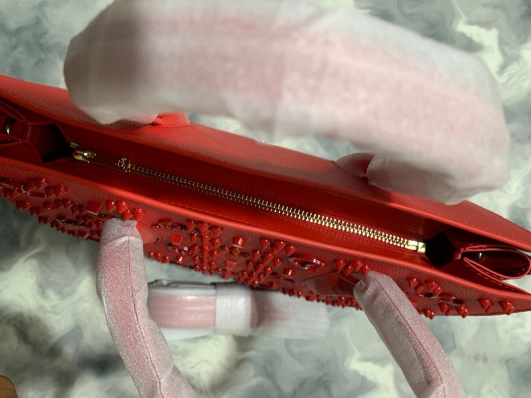 Christi** Loubout** red handbag