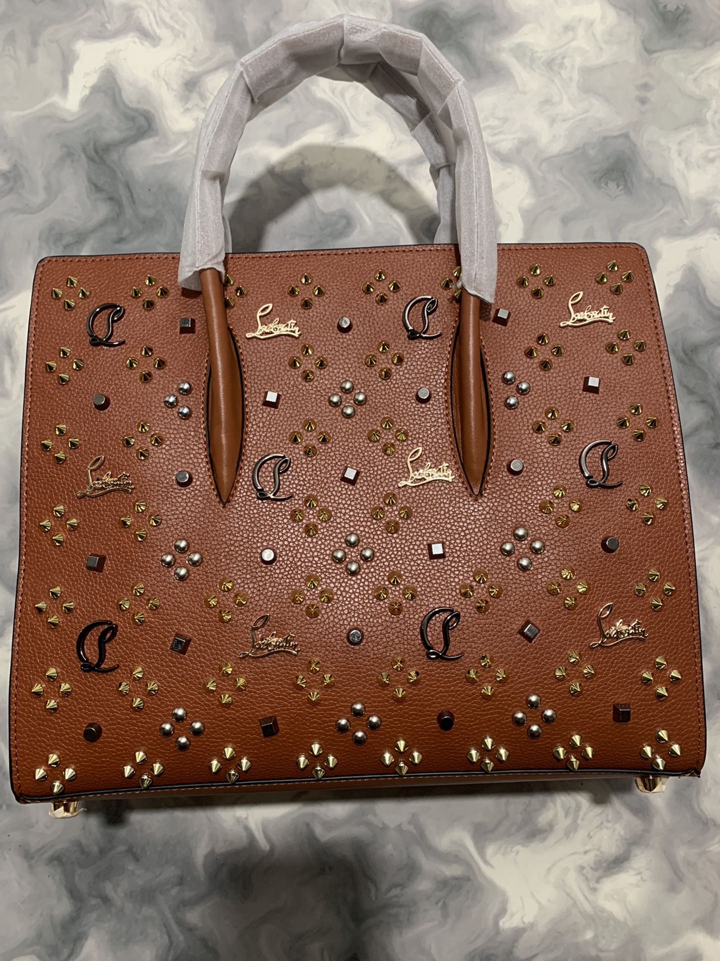 Christi** Loubout** red handbag