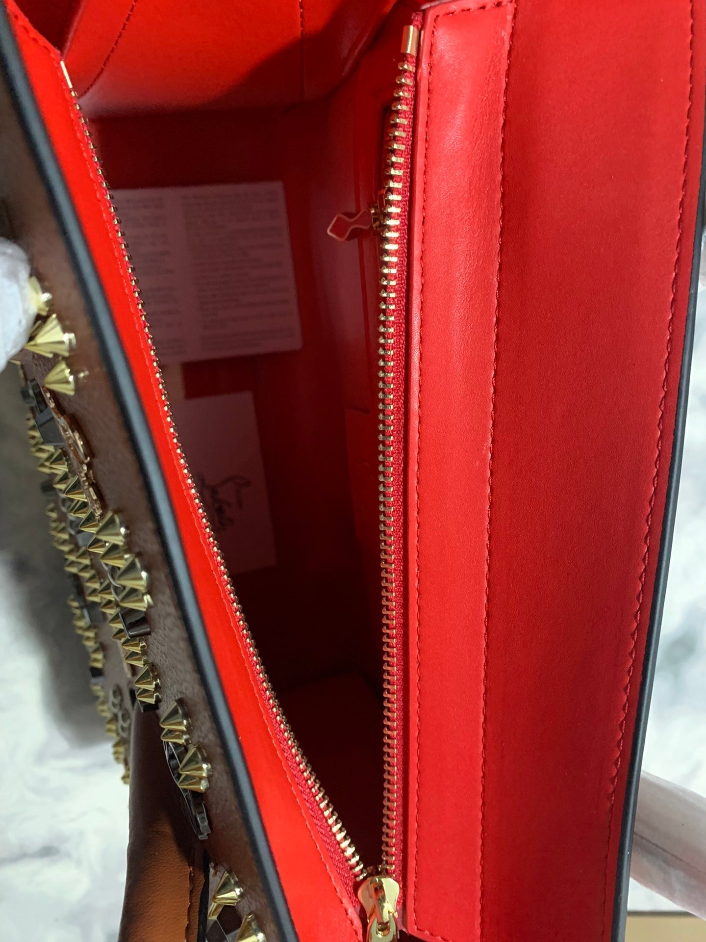 Christi** Loubout** red handbag