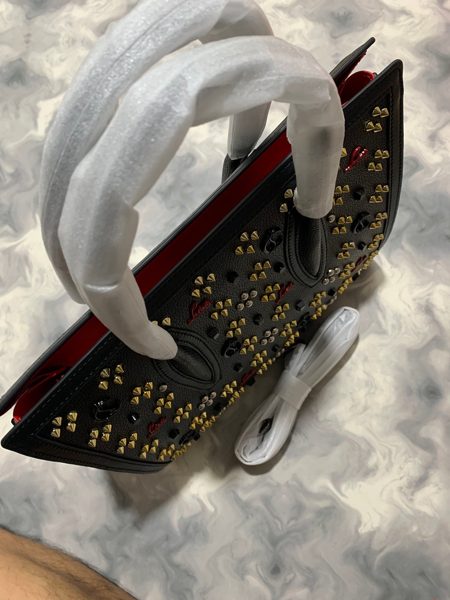 Christi** Loubout** red handbag