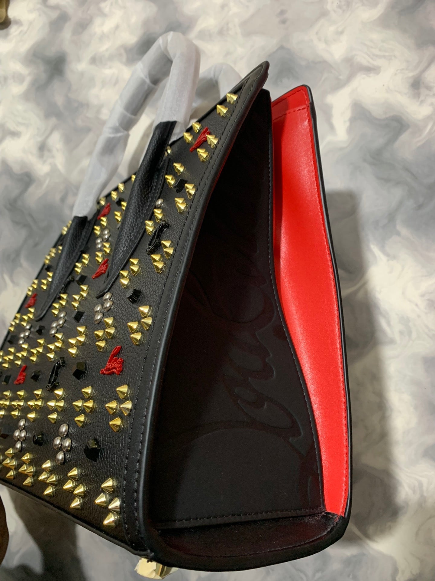 Christi** Loubout** red handbag