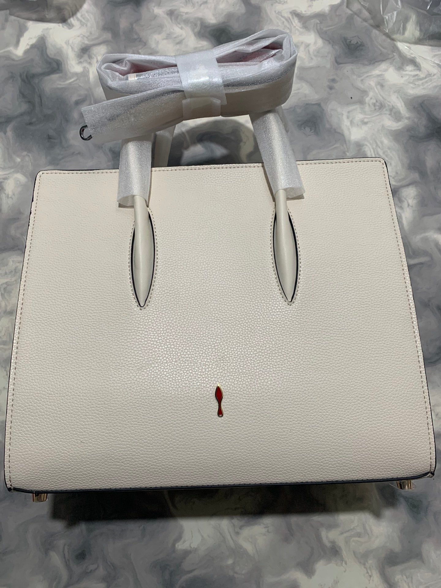 Christi** Loubout** red handbag