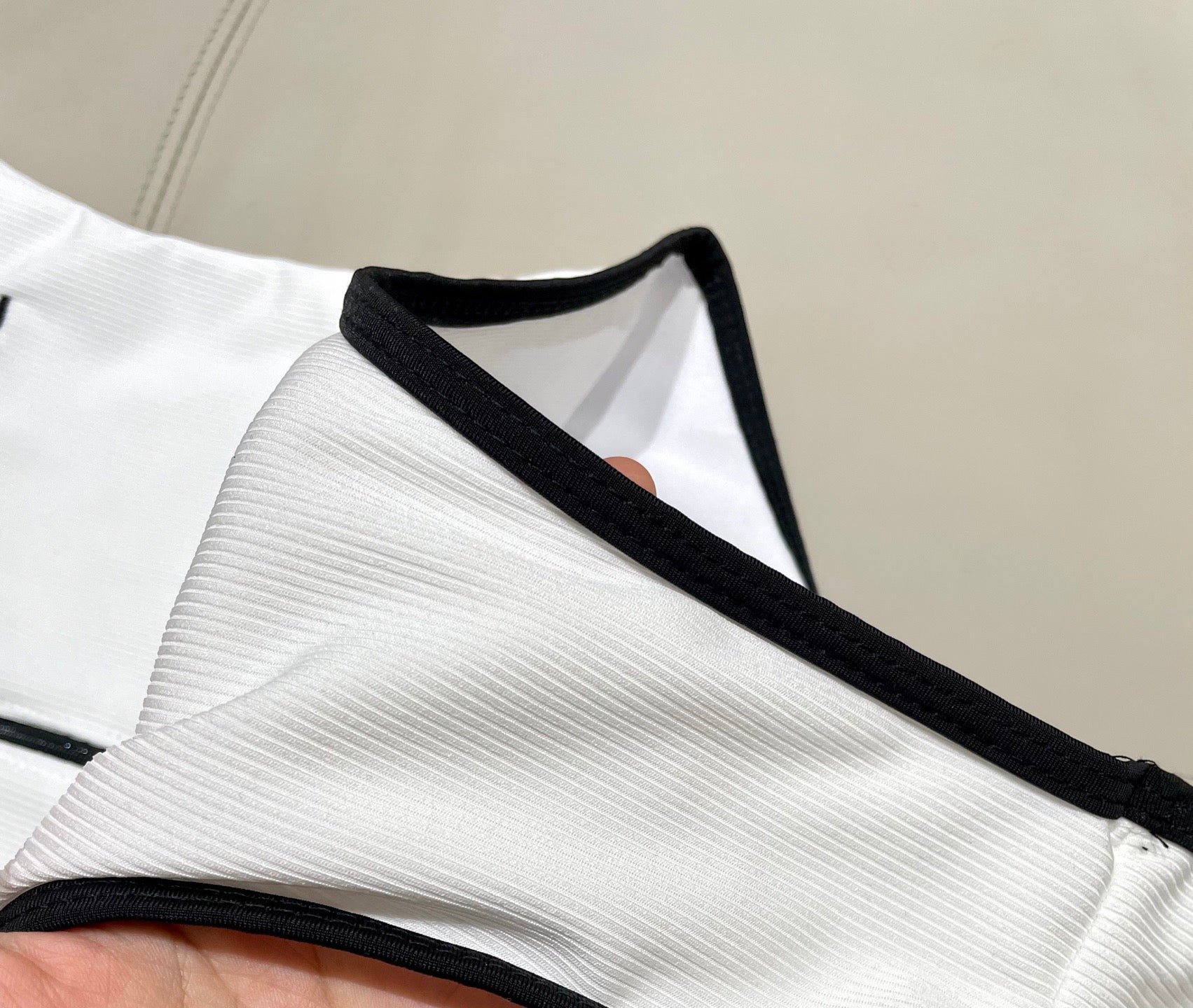 One-piece swimsuit with built-in bra pads.
