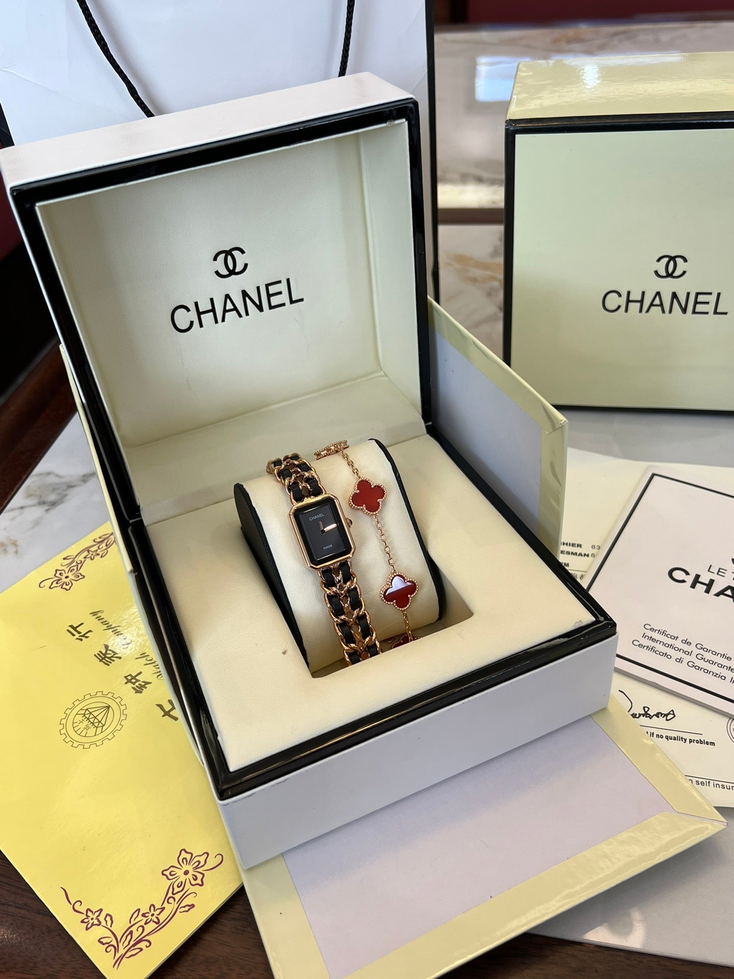 A four-leaf clover bracelet paired with a watch strap is absolutely perfect.