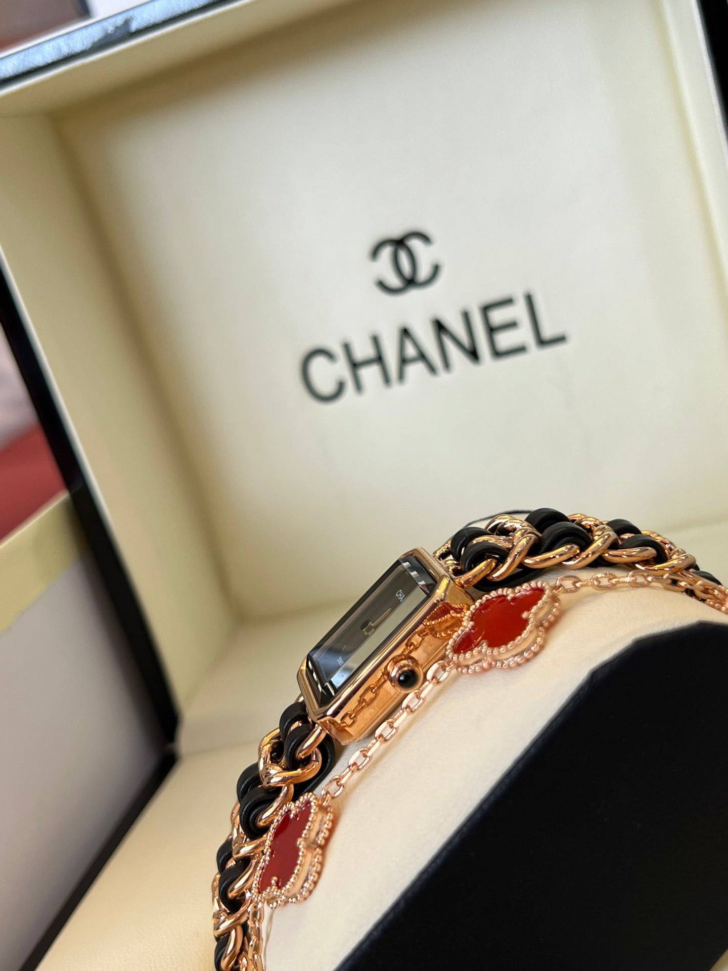 A four-leaf clover bracelet paired with a watch strap is absolutely perfect.