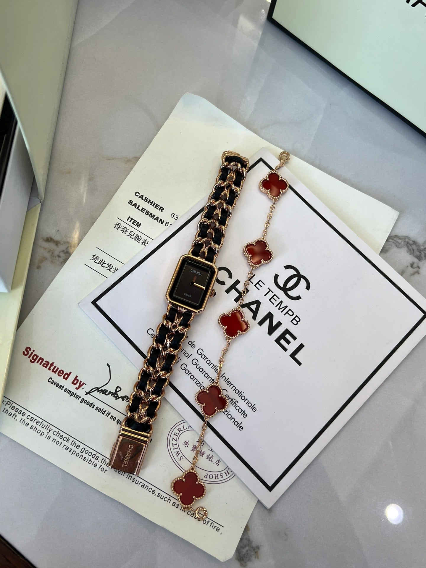 A four-leaf clover bracelet paired with a watch strap is absolutely perfect.