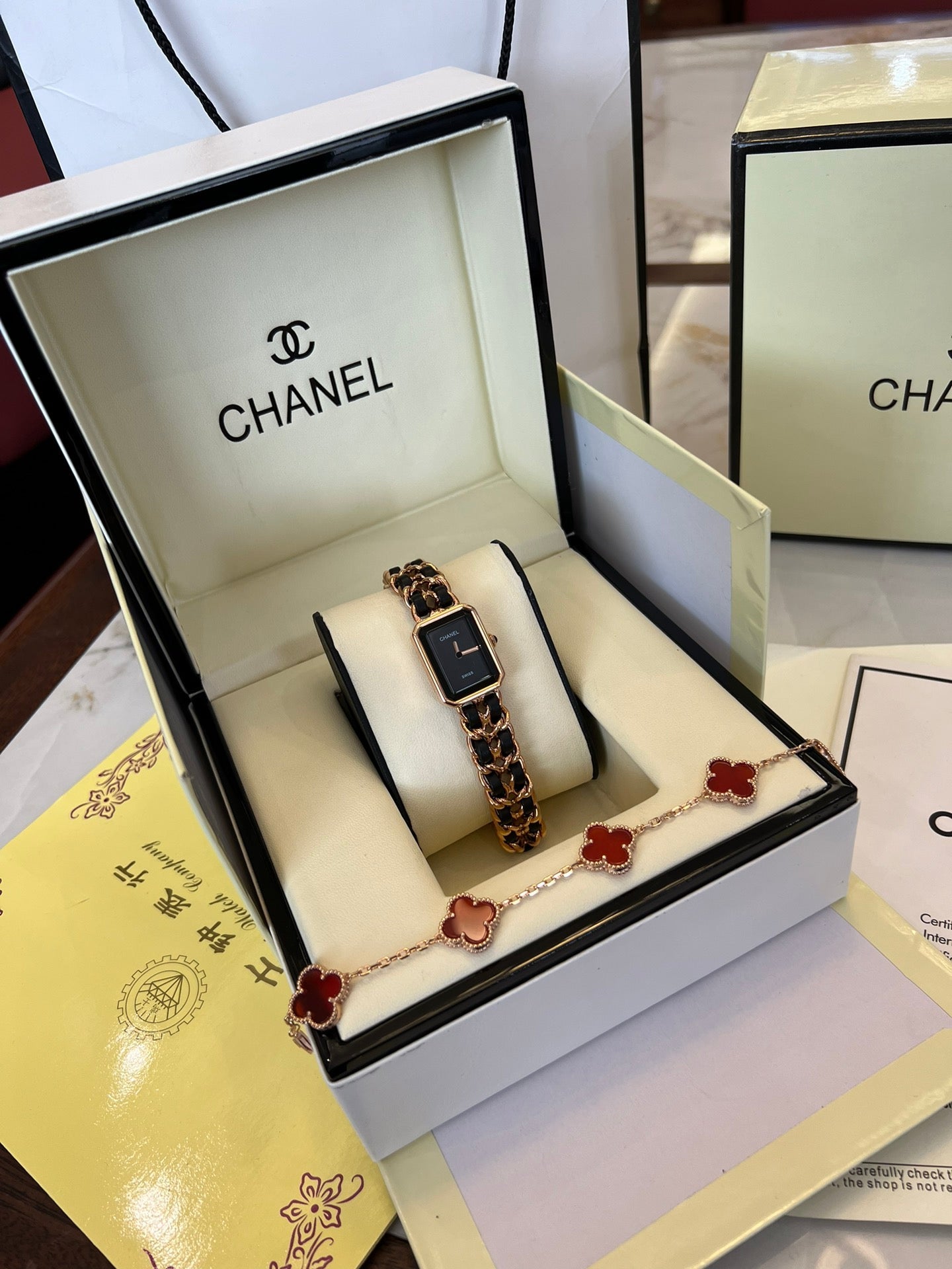 A four-leaf clover bracelet paired with a watch strap is absolutely perfect.