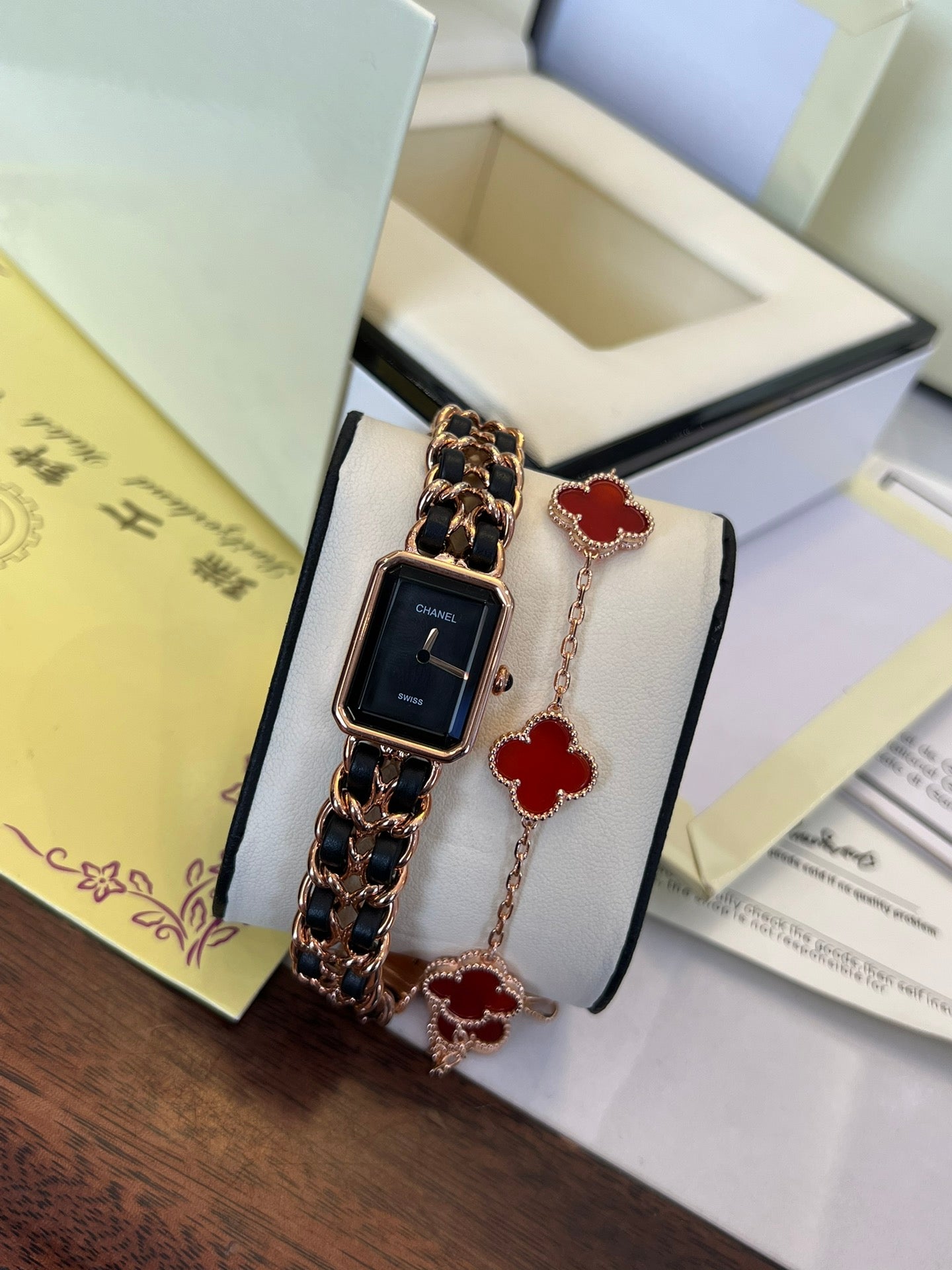 A four-leaf clover bracelet paired with a watch strap is absolutely perfect.