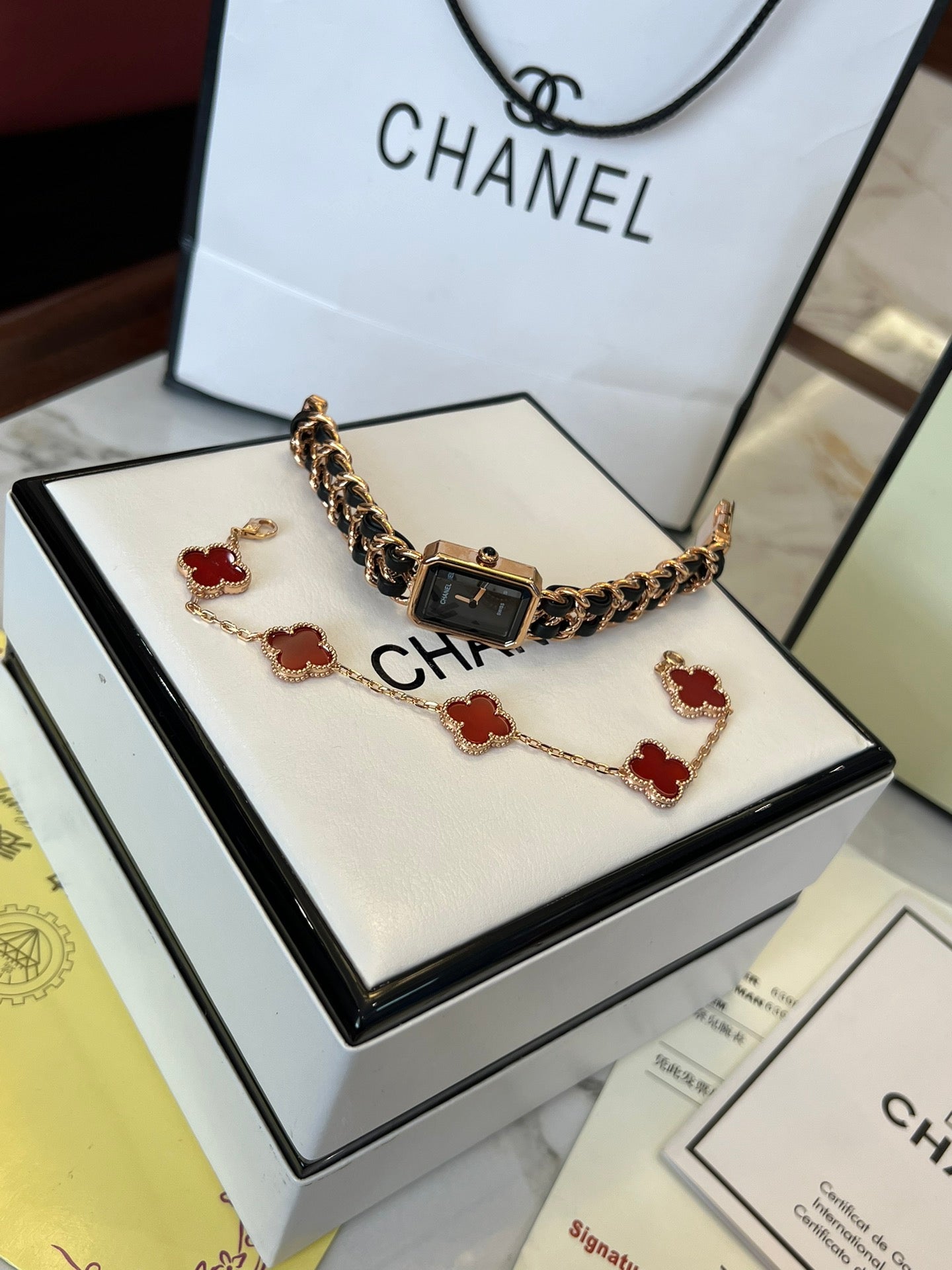 A four-leaf clover bracelet paired with a watch strap is absolutely perfect.