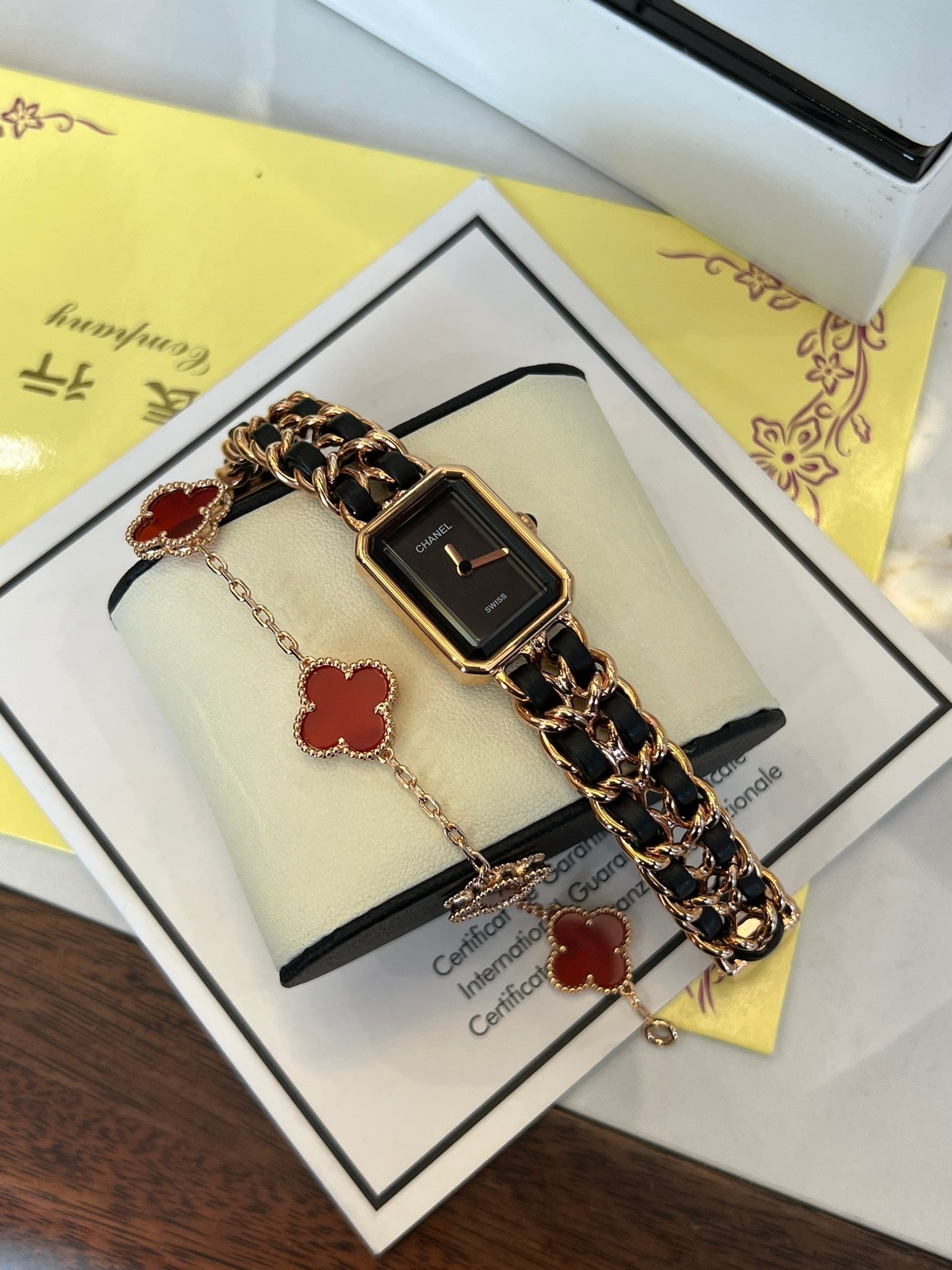 A four-leaf clover bracelet paired with a watch strap is absolutely perfect.